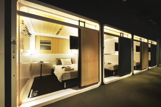 Corridor of stacked sleeping cabins inside a capsule hotel in Tokyo