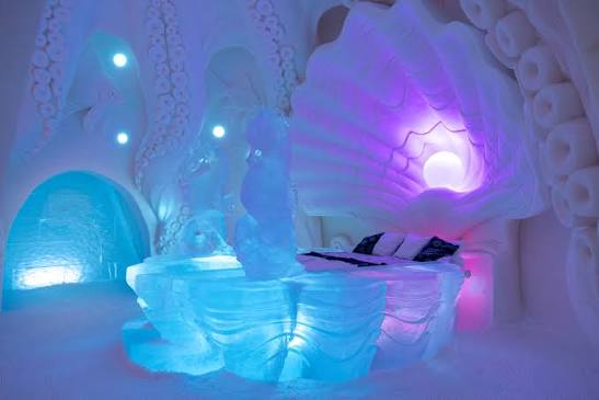 Carved snow structures standing on an open cleared site in Finnish Lapland